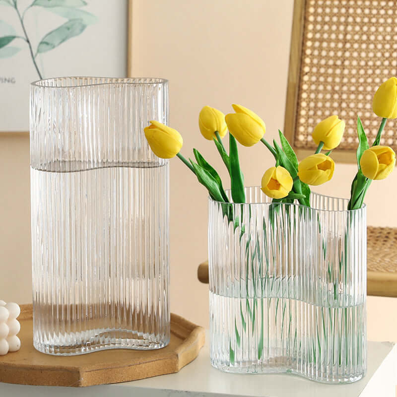 Hydroponic flowers in a transparent glass vase for elegant living room desktop decoration"