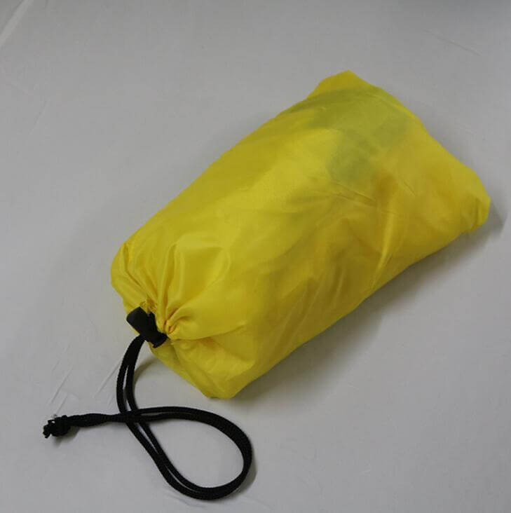 Yellow resistance parachute umbrella packed in a drawstring bag.