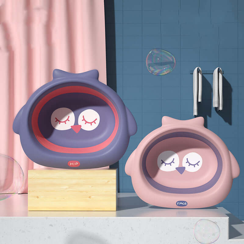 Two cute owl-shaped small basins in soft fog powder and dark night purple, perfect for children's bath time.
