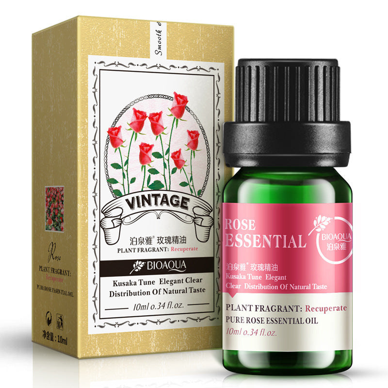 Rose essential oil 10ml in dark green bottle with vintage-themed packaging, featuring rose illustrations and Bioaqua branding.
