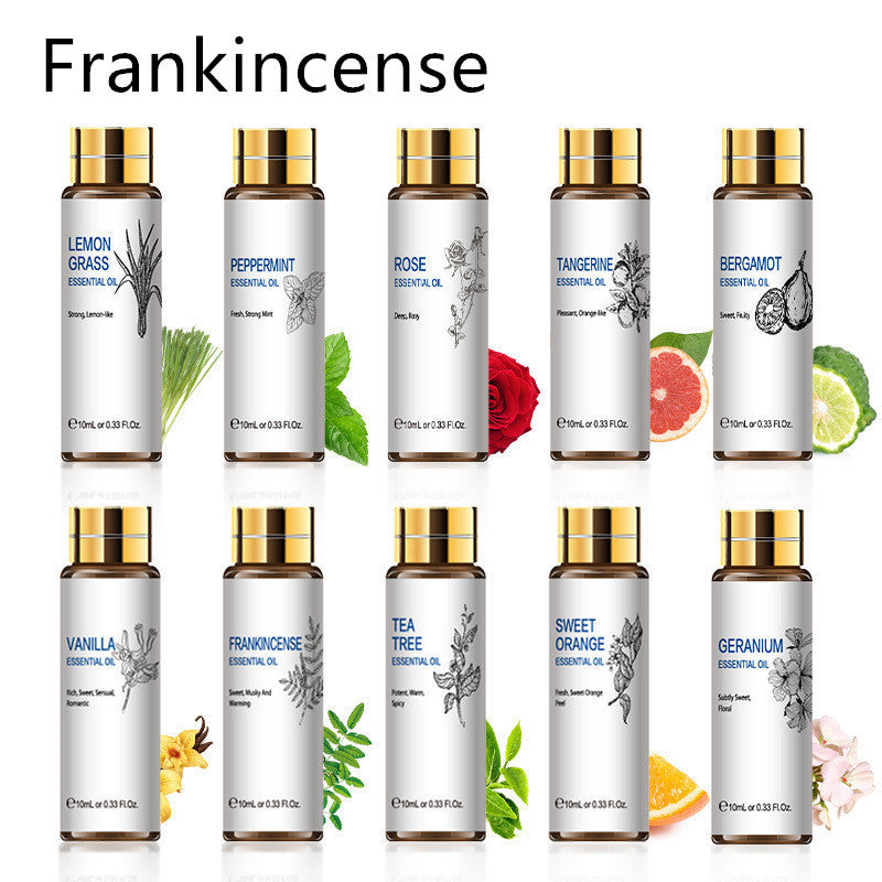 Collection of essential oils including frankincense, lemon grass, peppermint, rose, and more, in 10ml bottles with floral accents.