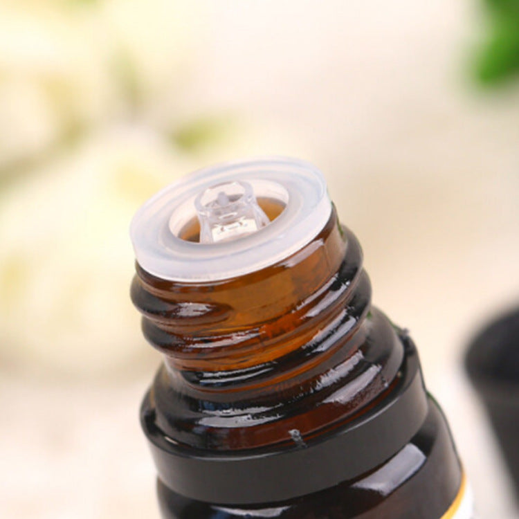 Close-up of Tea Tree Essential Oil 10ml bottle opening, used for aromatherapy, massage, spa, and general skincare purposes.