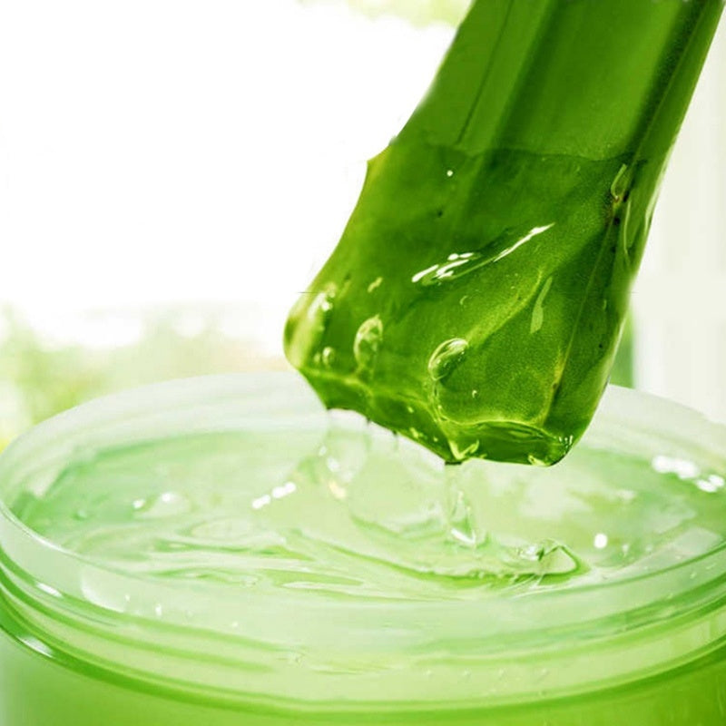 Melao Aloe Vera Gel 300g in a jar with fresh aloe plant, soothing skincare product for hydration and healing.