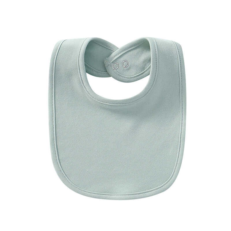 "Baby cotton bib with hidden buckle, available in solid colors and multiple options, designed to keep baby’s clothes clean and comfortable."