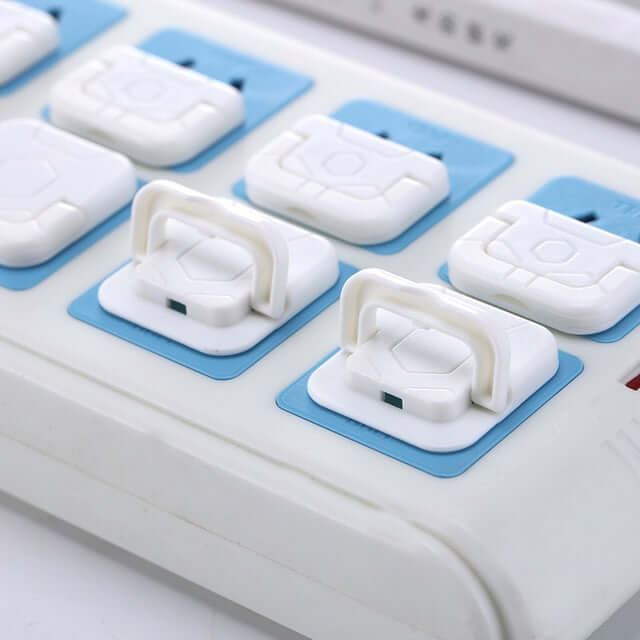 Child safety socket covers made of ABS resin, shown on a power strip, ensuring child protection and accident prevention.
