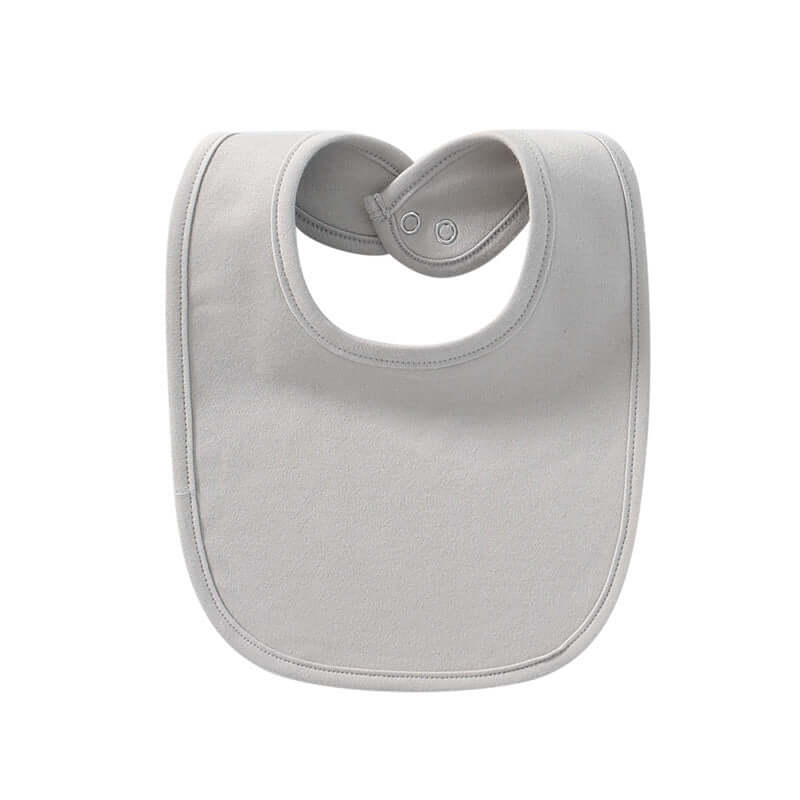 "Baby cotton bib with hidden buckle, available in solid colors and multiple options, designed to keep baby’s clothes clean and comfortable."