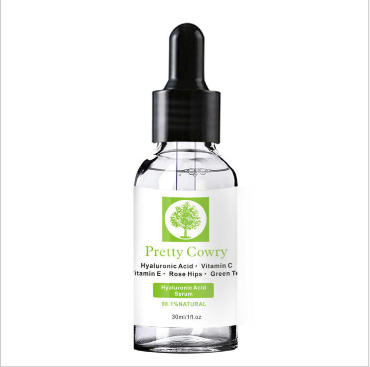 Pretty Cowry Vitamin C Serum bottle with dropper, featuring hyaluronic acid, vitamin E, and natural ingredients for skin brightening and moisturizing.