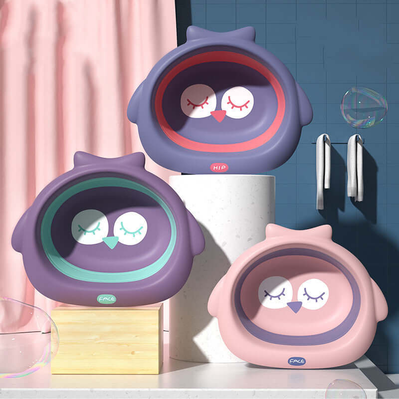 Colorful owl-shaped baby basins in soft fog powder, dark night purple, and dream purple for children's bath time.