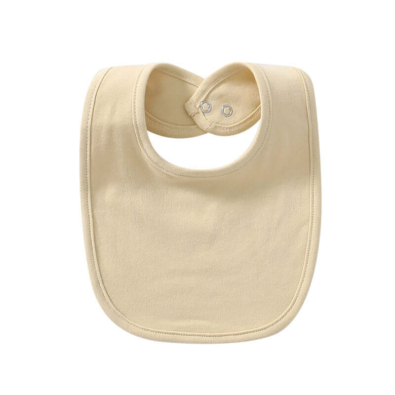 "Baby cotton bib with hidden buckle, available in solid colors and multiple options, designed to keep baby’s clothes clean and comfortable."