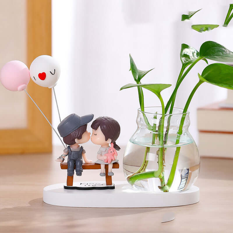 "Transparent glass vase with flower arrangement ornaments and water for growing flowers"