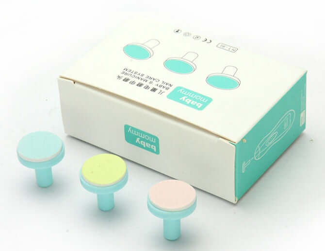 Electric baby nail sharpener replacement heads with abrasive discs for infant nail care, shown with packaging.