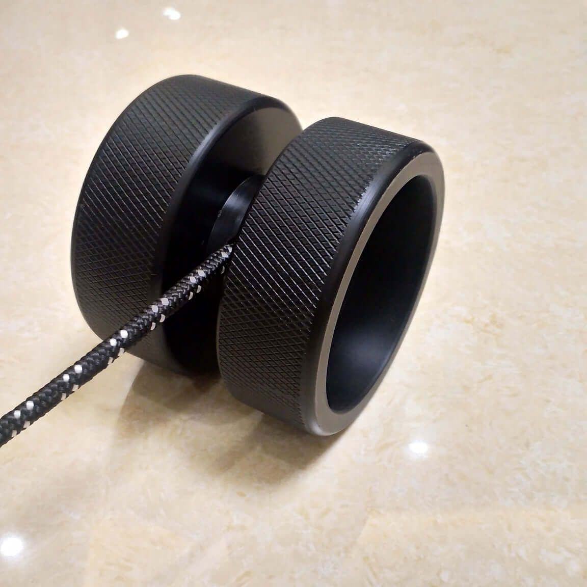 Close-up of ergonomic grips on weight-bearing wrist exercise equipment for improved hand strength”