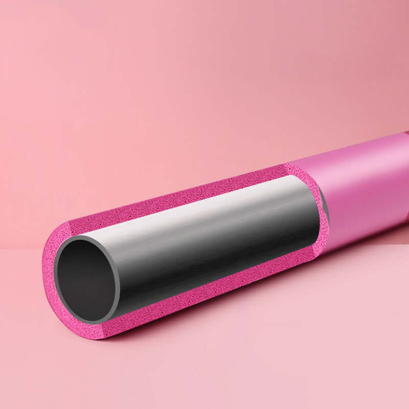 Close-up of pink Pilates fitness bar with foam padding, showcasing inner tube structure for elastic exercise training.