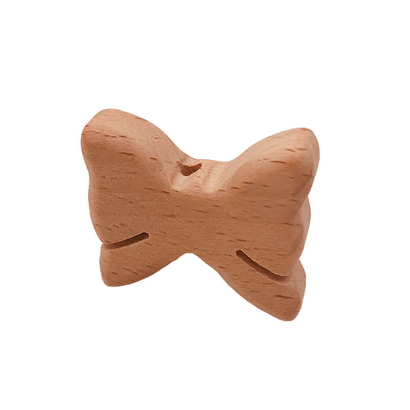 Natural beech wood butterfly-shaped baby teething toy for grinding teeth.