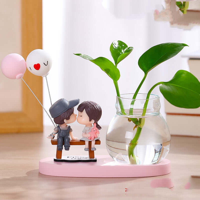 "Transparent glass vase with flower arrangement ornaments and water for growing flowers"
