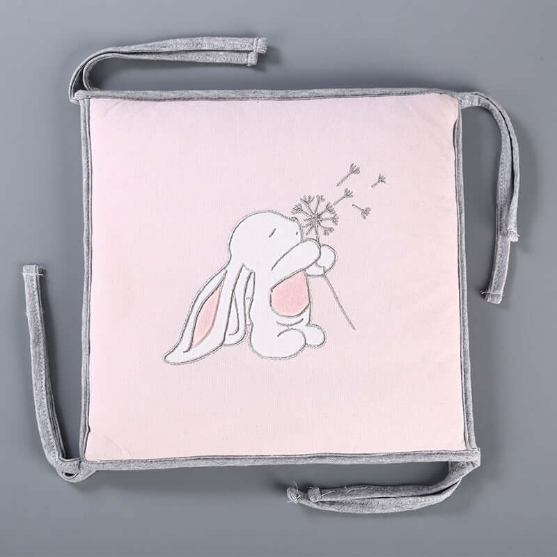 Knitted crib bed fence with embroidered bunny design, part of a 5-piece baby product set for cribs.