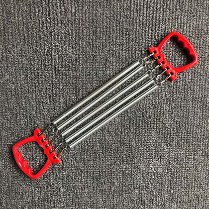 Chest expander training exercise equipment with carbon springs and red ABS plastic handles on a textured grey background