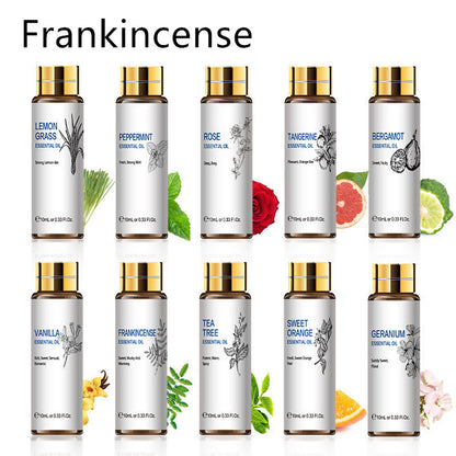 Collection of essential oils including frankincense, lemon grass, peppermint, rose, and more, in 10ml bottles with floral accents.
