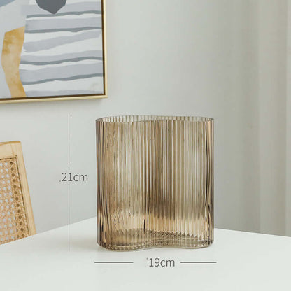 Hydroponic flowers in a transparent glass vase for elegant living room desktop decoration"