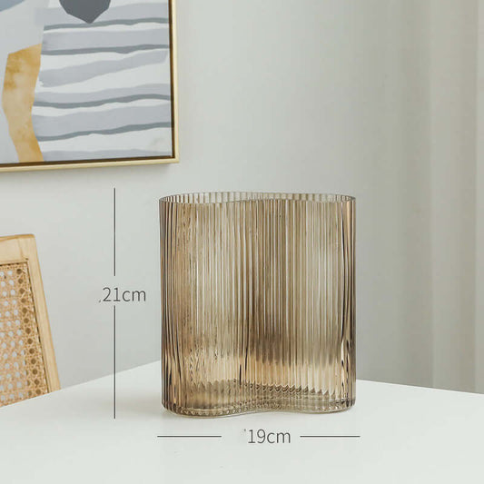Hydroponic flowers in a transparent glass vase for elegant living room desktop decoration"