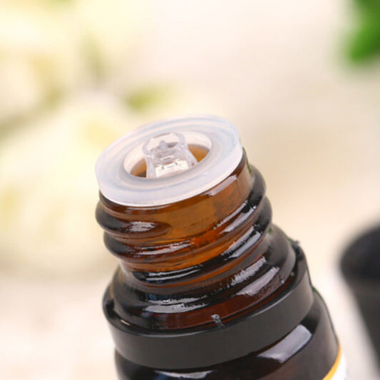 Close-up of Tea Tree Essential Oil 10ml bottle opening, used for aromatherapy, massage, spa, and general skincare purposes.
