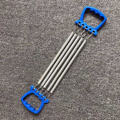 Chest expander training equipment with carbon springs and blue ABS plastic handles on a gray background