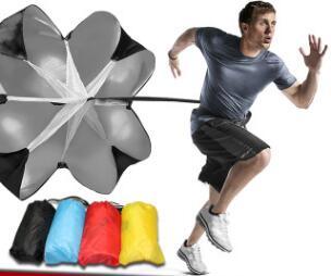 Man using running parachute outdoor exercise tool with resistance umbrella in various colors for speed training.