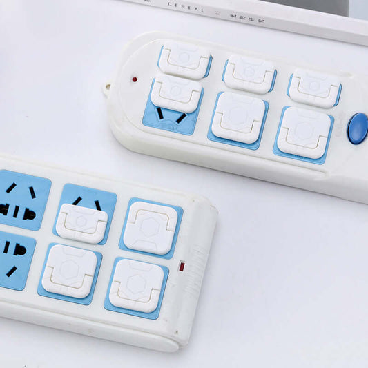 Child safety socket covers for electrical outlets to protect children from accidents, made from durable ABS resin in blue and white.