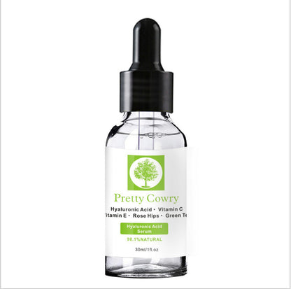 Pretty Cowry Vitamin C Serum bottle with dropper, featuring hyaluronic acid, vitamin E, and natural ingredients for skin brightening and moisturizing.