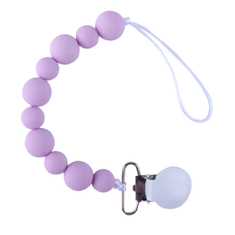 Purple silicone pacifier clip chain for babies, keeps pacifier clean and within reach, suitable for ages 3 months and up.