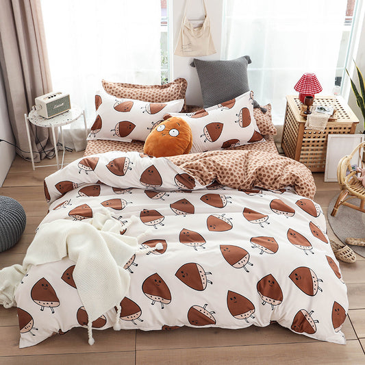 Cozy bedroom with aloe cotton sheet set featuring cute brown mushroom print on white, styled with pillows and a plush toy.