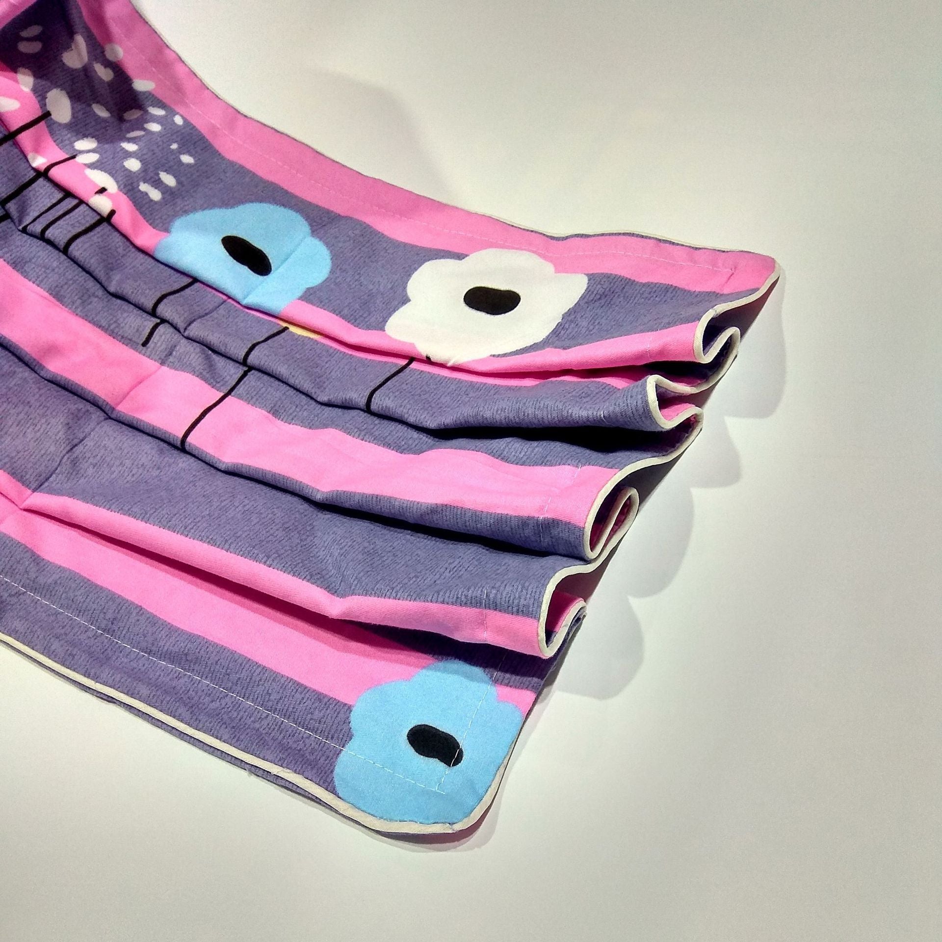 Colorful cotton twill pillowcase with floral design in pink, purple, and blue hues, showcasing eco-friendly polyester blend fabric