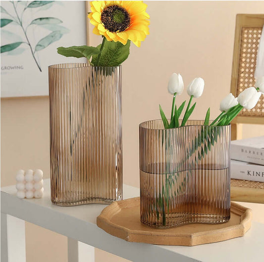 Hydroponic flowers in a transparent glass vase for elegant living room desktop decoration"