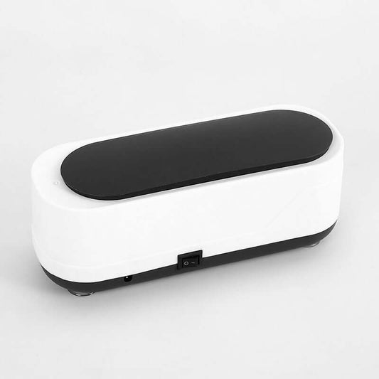 Multifunctional ultrasonic cleaner in black and white design for eyeglasses and baby products, size 152x54x36mm.