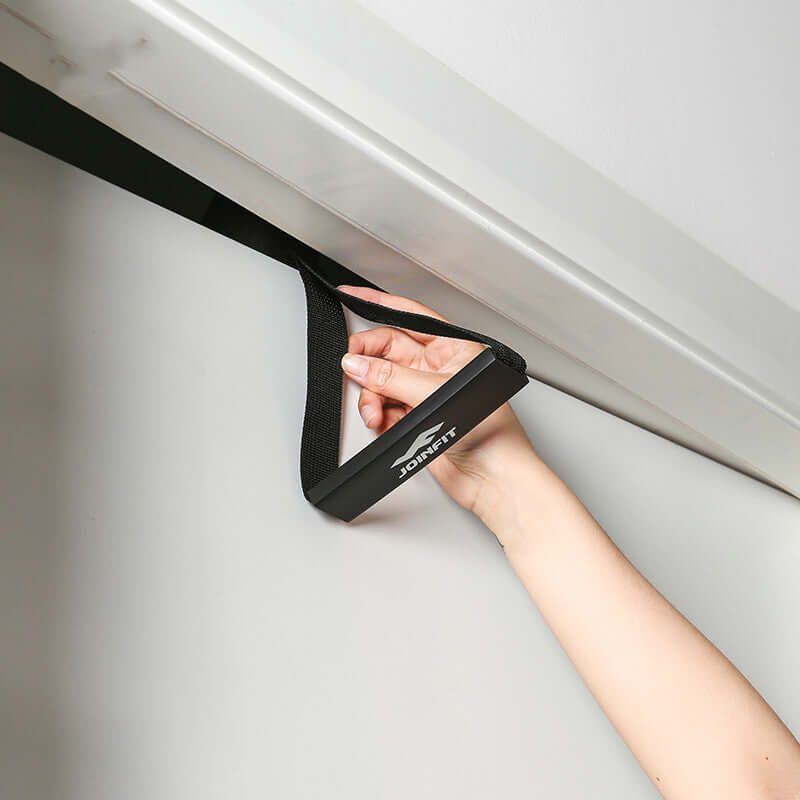 Handle Home Resistance Training Exercise Fitness Equipment in use by hand over door frame.