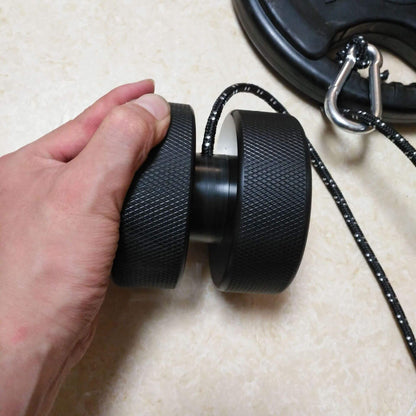 Close-up of ergonomic grips on weight-bearing wrist exercise equipment for improved hand strength”