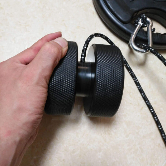Close-up of ergonomic grips on weight-bearing wrist exercise equipment for improved hand strength”