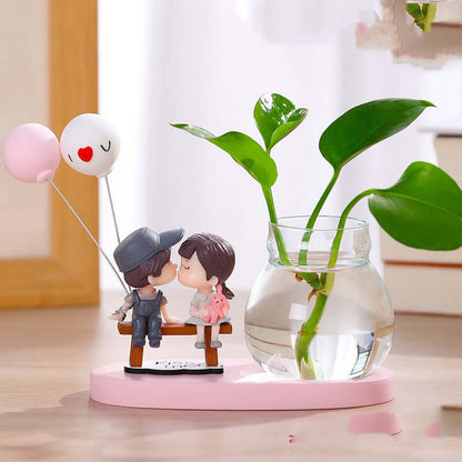 "Transparent glass vase with flower arrangement ornaments and water for growing flowers"